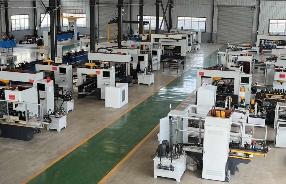 Workshop floor with over a dozen completed automatic square tube straightening machines staged for shipment
